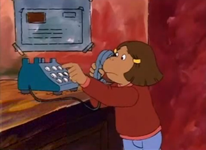 Francine dialing her family's apartment phone number.